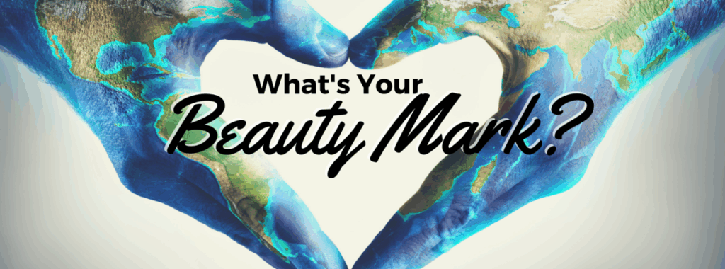 hands in heart shape painted like the earth