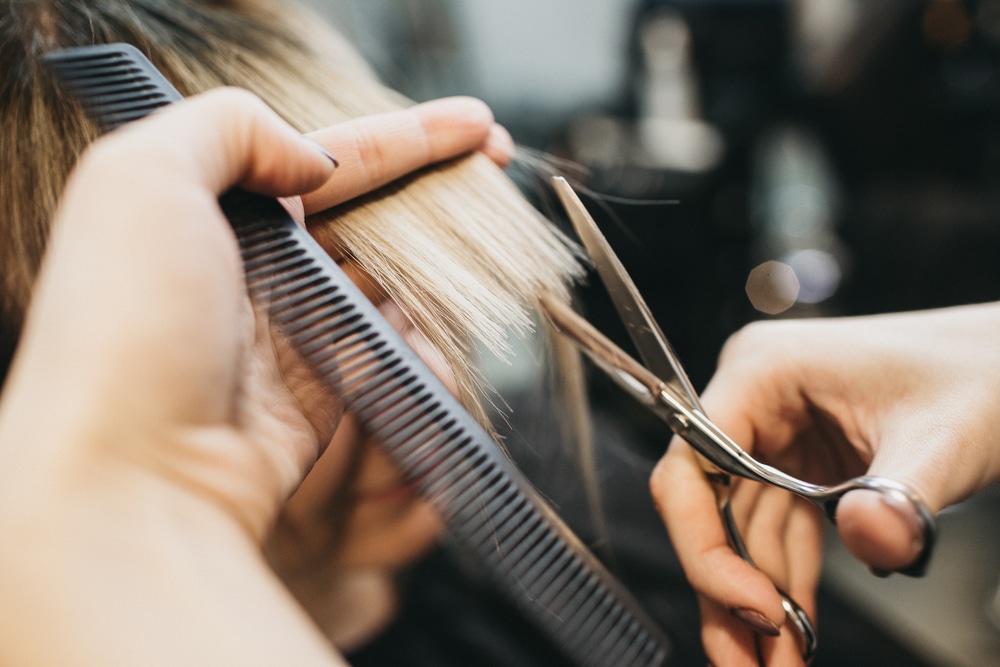 hairdresser cutting hair