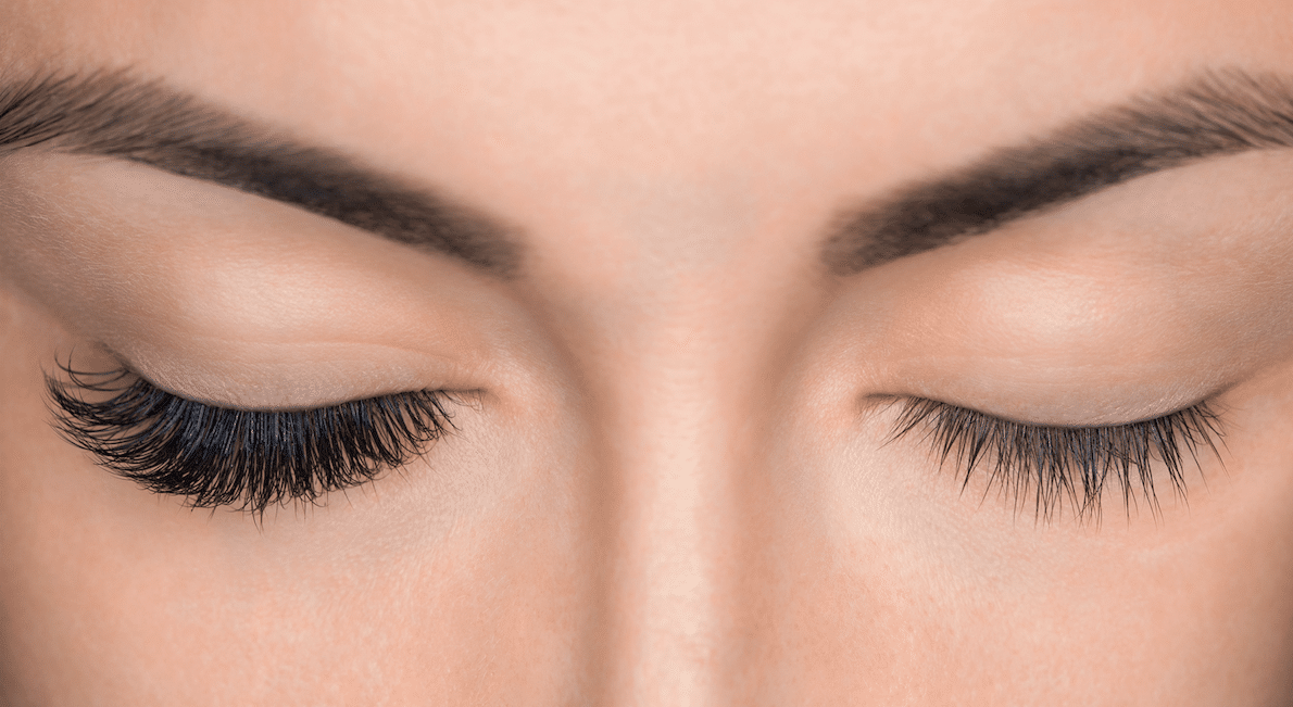 Woman half way through a lash extension process