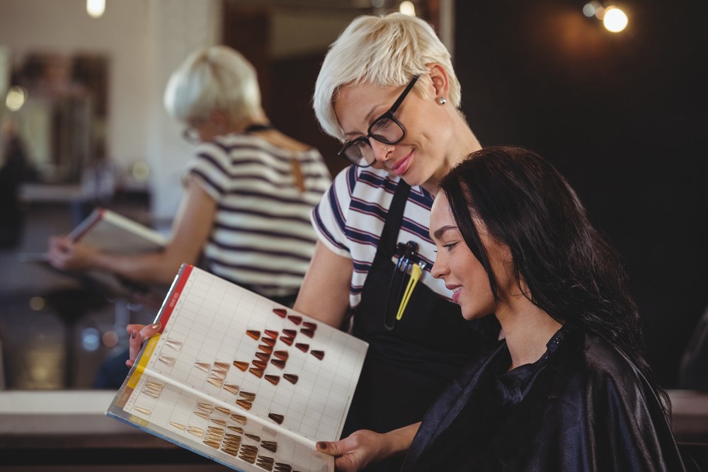 stylist helping client pick hair color