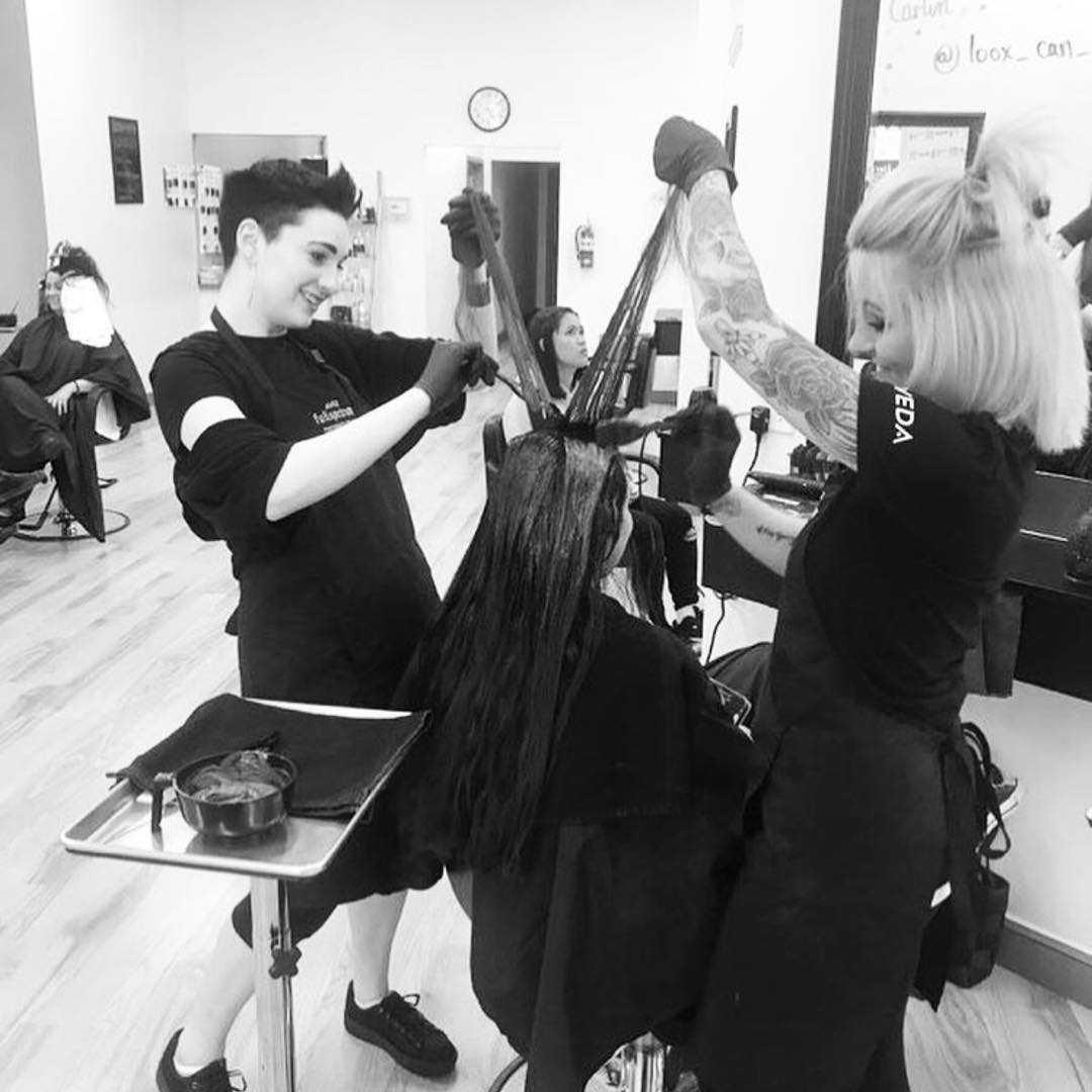 Aveda students working with client