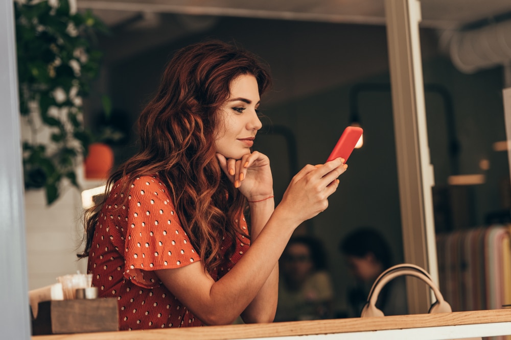 woman looking at her phone